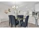 View of the dining area with seating for six, open to the modern kitchen at 3180 Paradox Cir # 304, Kissimmee, FL 34746