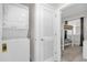 Laundry room with stackable washer and dryer, and access to the bedroom at 3180 Paradox Cir # 304, Kissimmee, FL 34746