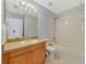 Well-lit bathroom with vanity, mirror, and a shower-tub combination at 3222 Eagle Creek Ln, Kissimmee, FL 34746