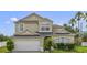 Charming two-story home with a two-car garage and well-maintained landscaping at 3222 Eagle Creek Ln, Kissimmee, FL 34746