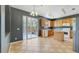 Open kitchen with an island, ample counter space, and sliding glass doors at 3222 Eagle Creek Ln, Kissimmee, FL 34746