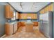 Bright kitchen with abundant storage, stainless steel refrigerator, and an island at 3222 Eagle Creek Ln, Kissimmee, FL 34746