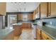 Well-equipped kitchen featuring ample cabinetry, an island, and modern appliances at 3222 Eagle Creek Ln, Kissimmee, FL 34746