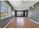 Inviting living room featuring large windows, wood floors, and a ceiling fan at 3222 Eagle Creek Ln, Kissimmee, FL 34746