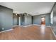 Spacious living room with hardwood floors, gray walls and abundant natural light at 3222 Eagle Creek Ln, Kissimmee, FL 34746