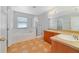 Main bathroom with a large soaking tub, shower, and double sink vanity at 3222 Eagle Creek Ln, Kissimmee, FL 34746