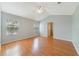 Vaulted ceiling main bedroom with wood-look flooring, and natural light at 3222 Eagle Creek Ln, Kissimmee, FL 34746
