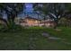 Lush backyard featuring a screened enclosure with a pool and ample space for outdoor activities and relaxation at 3461 Michigan St, Lake Mary, FL 32746