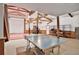 Spacious basement with a ping pong table, gym equipment, and garage door, great for recreation and hobbies at 3461 Michigan St, Lake Mary, FL 32746