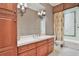 Bathroom featuring a vanity with cabinets and drawers, tile floors, and a glass-enclosed shower at 3461 Michigan St, Lake Mary, FL 32746
