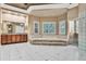 Spacious primary bathroom featuring a soaking tub, glass block shower, and wood cabinetry at 3461 Michigan St, Lake Mary, FL 32746