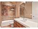 Well-lit bathroom with stylish tile shower and modern vanity at 3461 Michigan St, Lake Mary, FL 32746