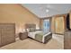 Comfortable bedroom with neutral decor, soft lighting, and access to a private balcony at 3461 Michigan St, Lake Mary, FL 32746