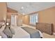 Spacious bedroom features an ensuite bathroom, a ceiling fan and large windows at 3461 Michigan St, Lake Mary, FL 32746