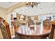 Open concept dining room with view into kitchen at 3461 Michigan St, Lake Mary, FL 32746