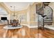 Dining room featuring chandelier, spiral staircase, and hardwood floors at 3461 Michigan St, Lake Mary, FL 32746