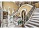 Grand foyer features a high ceiling, elegant staircase, and checkered marble flooring at 3461 Michigan St, Lake Mary, FL 32746