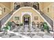 Impressive foyer with grand staircases, marble flooring, and elegant décor, creating a luxurious entrance to the home at 3461 Michigan St, Lake Mary, FL 32746