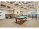 Large game room with coffered ceilings, a pool table, and access to the home theater at 3461 Michigan St, Lake Mary, FL 32746