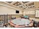 Entertainment room features a poker table, billiards, and space for relaxing at 3461 Michigan St, Lake Mary, FL 32746