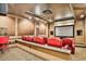 Home theater boasts plush seating, projector, and a popcorn machine for movie nights at 3461 Michigan St, Lake Mary, FL 32746