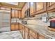 Kitchen featuring granite countertops, stainless steel appliances, and custom wood cabinets at 3461 Michigan St, Lake Mary, FL 32746
