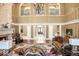 Elegant living room with fireplace, chandelier, and lots of seating at 3461 Michigan St, Lake Mary, FL 32746