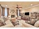 The cozy living room features a fireplace, multiple couches, and hardwood floors at 3461 Michigan St, Lake Mary, FL 32746