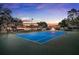 Well-maintained tennis court on the property, set against a backdrop of beautiful landscaping and estate buildings at 3461 Michigan St, Lake Mary, FL 32746