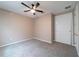 Bedroom with ceiling fan, neutral paint and plush carpet at 3651 Nw 56Th Ave, Ocala, FL 34482