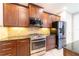 Modern kitchen featuring stainless steel appliances, dark wood cabinets, and granite countertops at 3651 Nw 56Th Ave, Ocala, FL 34482
