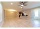 Spacious living room with tile flooring open to the kitchen and dining areas at 3651 Nw 56Th Ave, Ocala, FL 34482