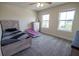 Bedroom with a twin bed, decor, and two large windows for ample natural light at 4007 Meandering Bay Dr, Apopka, FL 32712