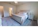 Spacious bedroom featuring a comfortable queen-sized bed and neutral decor at 4007 Meandering Bay Dr, Apopka, FL 32712