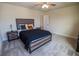 Spacious bedroom featuring a wood bed frame, carpet, and a ceiling fan at 4007 Meandering Bay Dr, Apopka, FL 32712