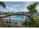 Community pool surrounded by lounge chairs and lush landscaping at 4007 Meandering Bay Dr, Apopka, FL 32712