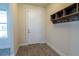 Practical entryway with tile floors, coat hooks, and storage cubbies for organization at 4007 Meandering Bay Dr, Apopka, FL 32712