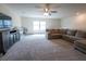 Upstairs living room with neutral carpet and plenty of natural light at 4007 Meandering Bay Dr, Apopka, FL 32712