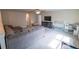 Spacious living room with plush carpeting and comfortable seating at 4007 Meandering Bay Dr, Apopka, FL 32712