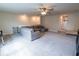 Large living room with neutral gray carpet and sectional couch at 4007 Meandering Bay Dr, Apopka, FL 32712