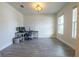 Bright and airy office with light neutral walls and tile floors, perfect for productivity at 4007 Meandering Bay Dr, Apopka, FL 32712