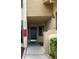 Inviting front entryway showcasing the home's address, a secure door, and exterior lighting for added curb appeal at 4372 Middlebrook Rd # 3, Orlando, FL 32811