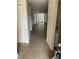 Interior view showcasing tile flooring and an open floor plan with doors leading to a bright room at 4372 Middlebrook Rd # 3, Orlando, FL 32811