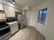 Efficient kitchen featuring stainless steel appliances, tile flooring, and ample storage, creating a functional space at 4372 Middlebrook Rd # 3, Orlando, FL 32811