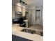 The kitchen features stainless steel appliances, wooden cabinets, and a washer-dryer unit at 4372 Middlebrook Rd # 3, Orlando, FL 32811