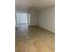 The living room features tile flooring and a ceiling fan, with doors leading to another room at 4372 Middlebrook Rd # 3, Orlando, FL 32811