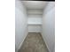 Well-organized walk-in closet, with ample shelving and storage space, offering an efficient organizational solution at 4372 Middlebrook Rd # 3, Orlando, FL 32811