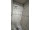 Modern shower featuring sleek gray and white tile work and contemporary fixtures at 4674 Pembrook Pl # J 101, Orlando, FL 32811