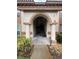 Inviting entrance with classic architectural details, pillars, and an arched entryway at 4674 Pembrook Pl # J 101, Orlando, FL 32811