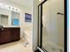 Bathroom features vanity, soaking tub, and glass enclosed shower at 4900 Beach Blvd, Orlando, FL 32803